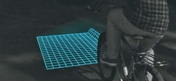 LED-подсветка для велосипеда, проецирующую на дорогу перед ездоком сетку, которая делает все неровности хорошо видимыми. На неровной поверхности она будет деформироваться. Кроме того, подсветка сделает велосипед более заметным для пешеходов и транспортных средств.